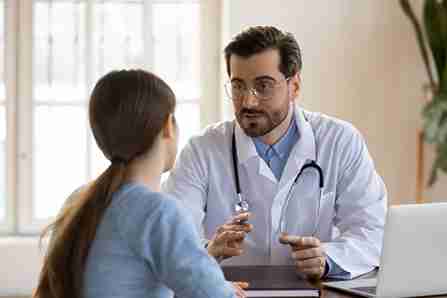 a doctor tells patients
